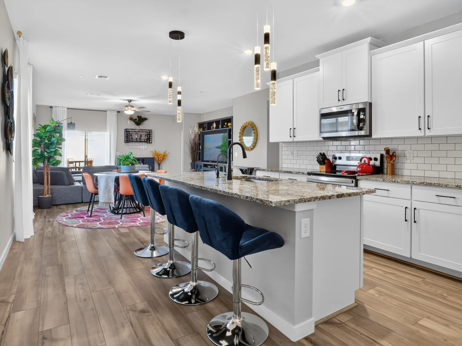 Kitchen with white cabinetry and island