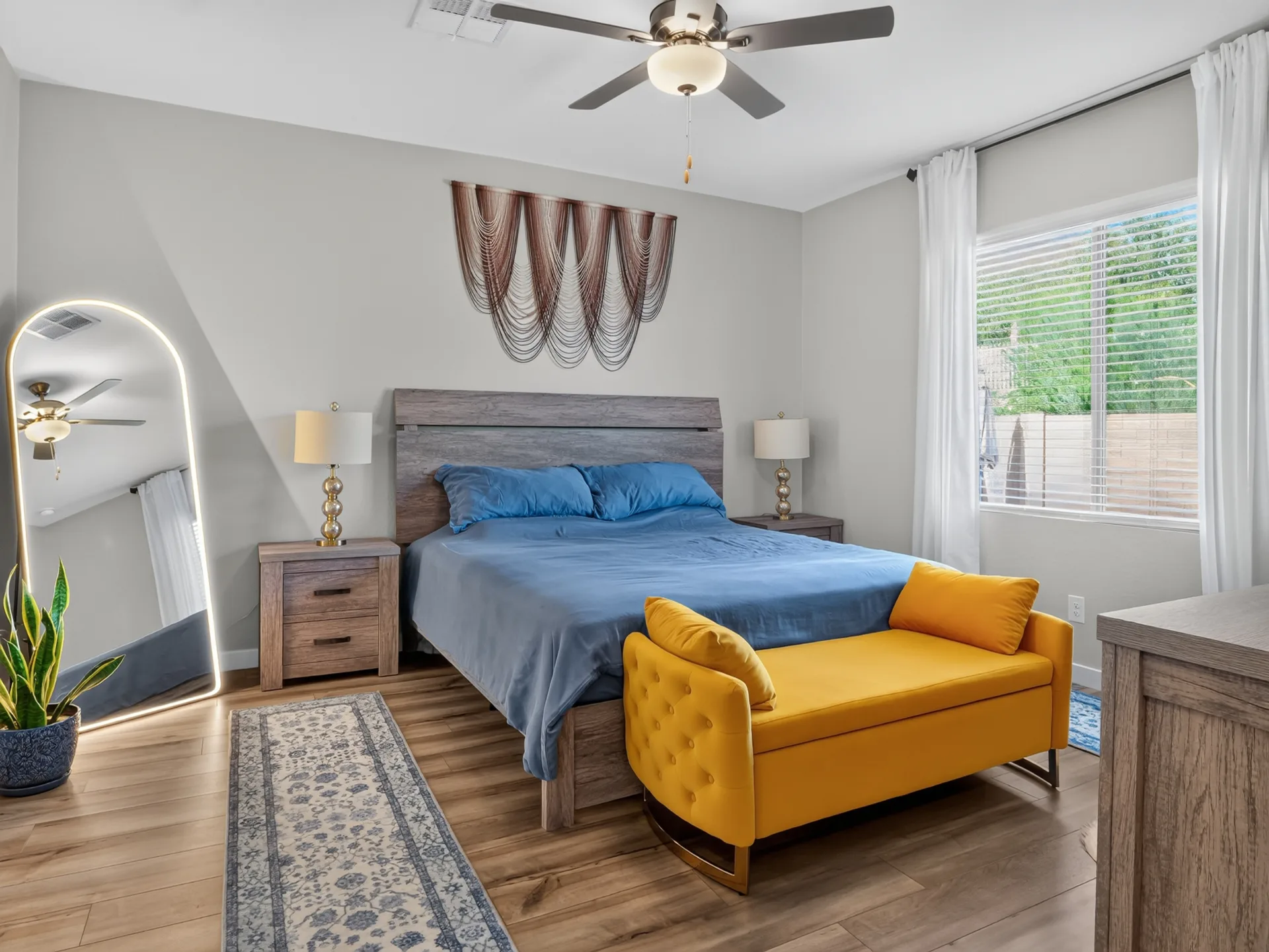 Primary bedroom with neutral finishes